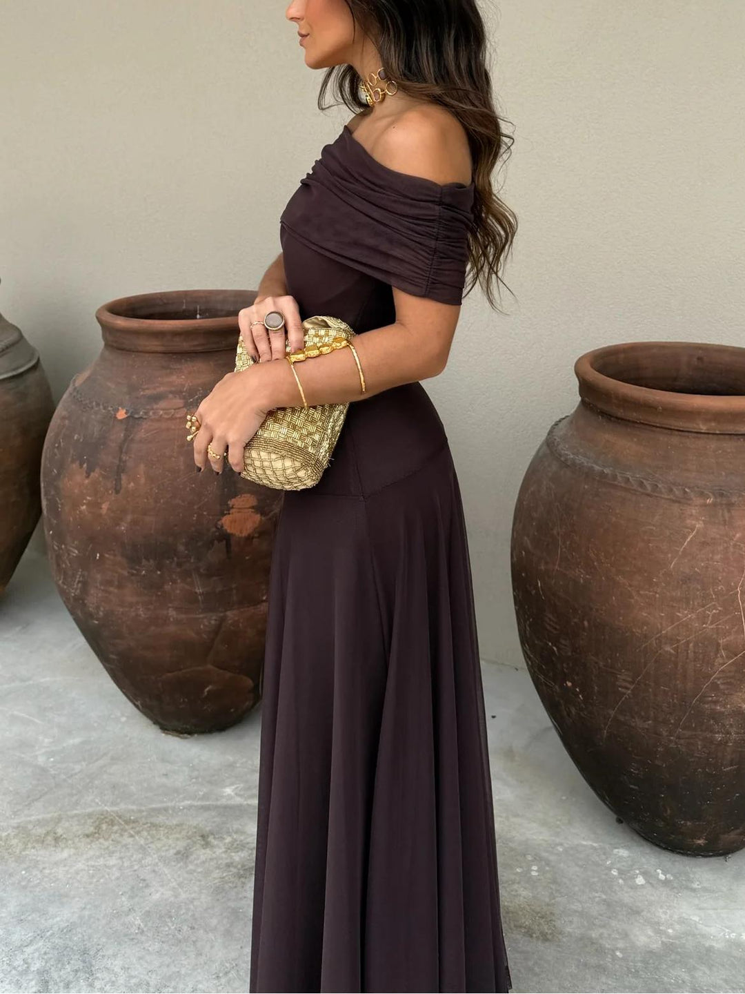 Brown elegant off-shoulder maxi dress, featuring a graceful A-line silhouette, ideal for formal women's events.