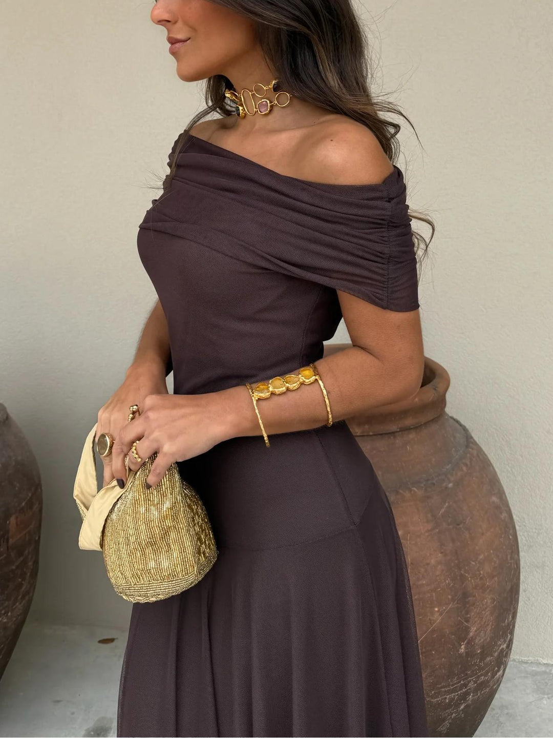 Women's elegant off-shoulder brown maxi dress, a formal A-line party gown for special occasions.