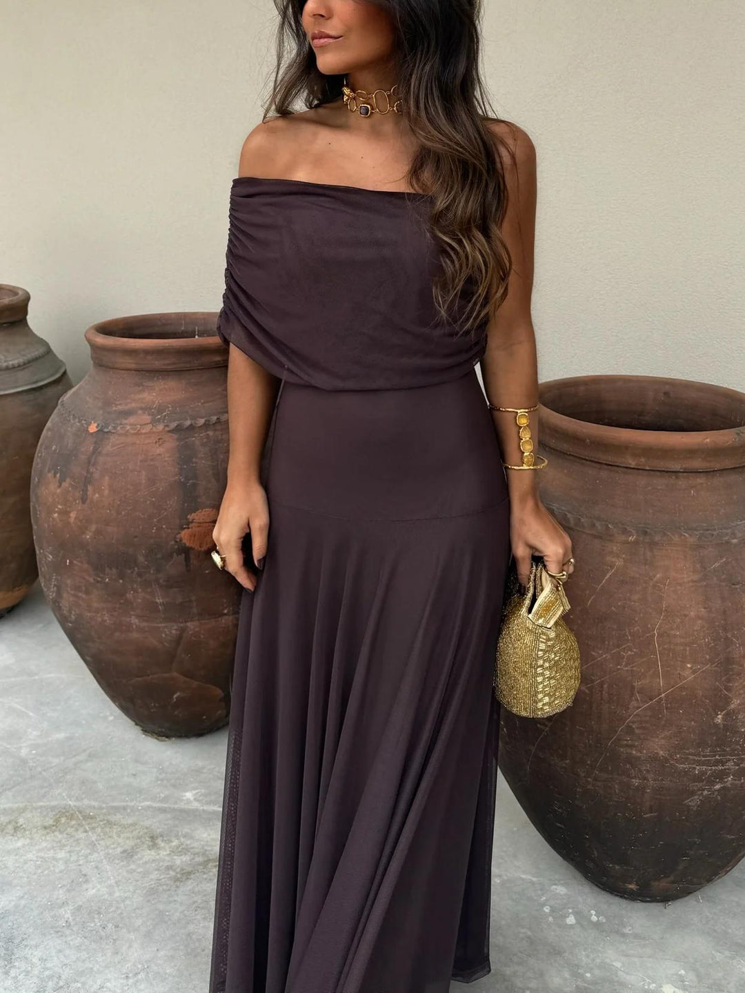 Flowing brown off-shoulder long maxi dress for women, an elegant A-line silhouette ideal for evening wear.