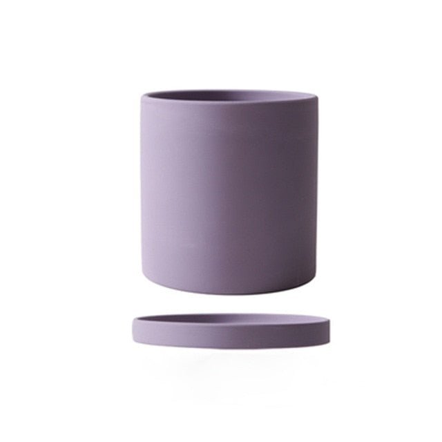 Sophisticated ceramic pot with saucer, elegantly elevates any room's home decor.