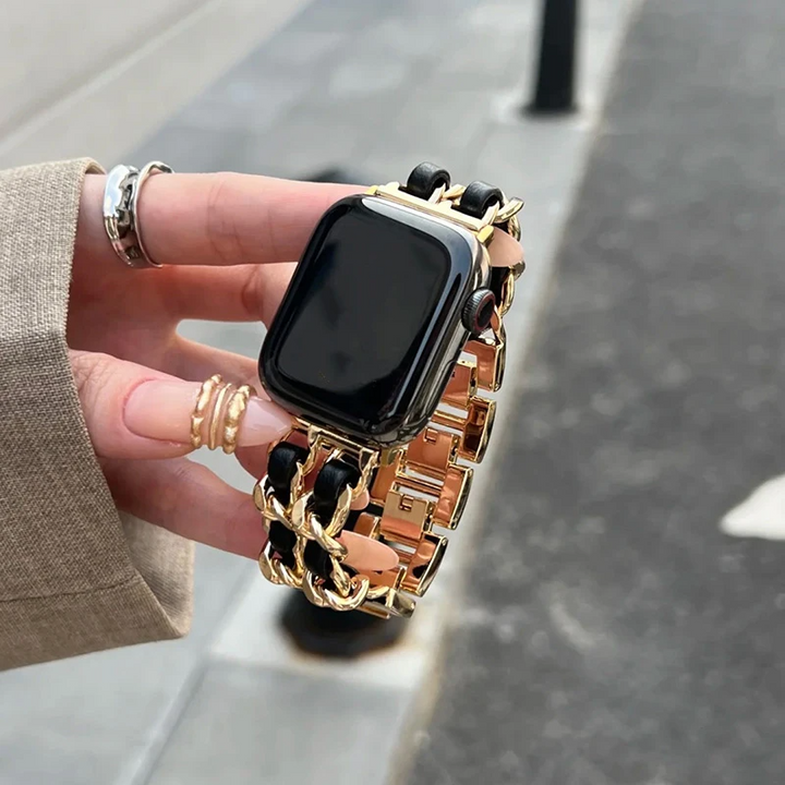 Elegant chain link metal Apple Watch band for women. Polished fashion accessory for smartwatches.