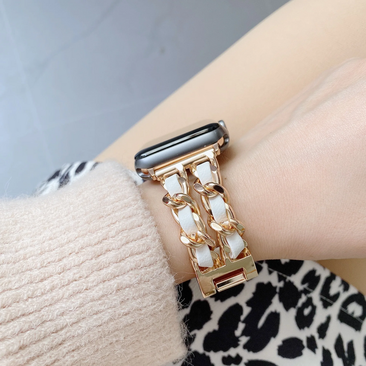 Luxury chain link Apple Watch strap for women, elegant polished metal design. Premium smartwatch accessory.