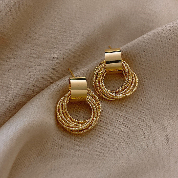 Simple elegant circle stud earrings. Versatile women's jewelry, a perfect minimalist fashion accessory.