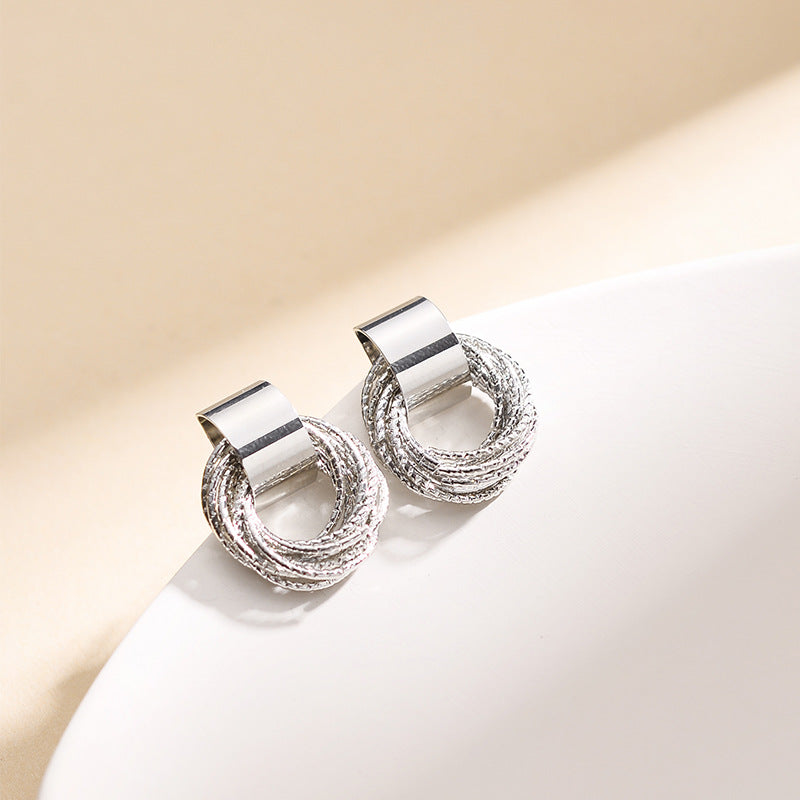 Feminine elegant circle stud earrings. Minimalist women's jewelry, perfect for versatile, timeless style.