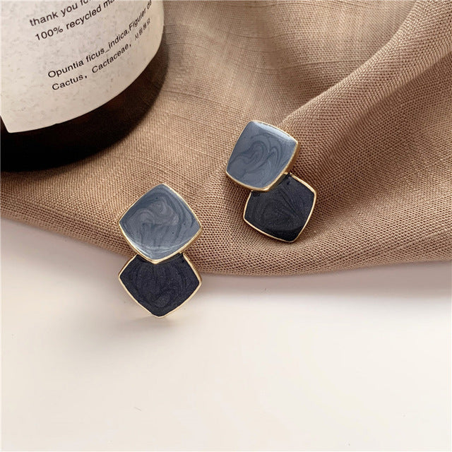 Chic gold-tone circle stud earrings. Elegant women's jewelry, a timeless minimalist fashion accessory.