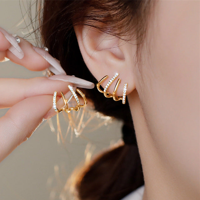 Modern elegant circle stud earrings. Minimalist women's jewelry, a chic versatile fashion accessory.