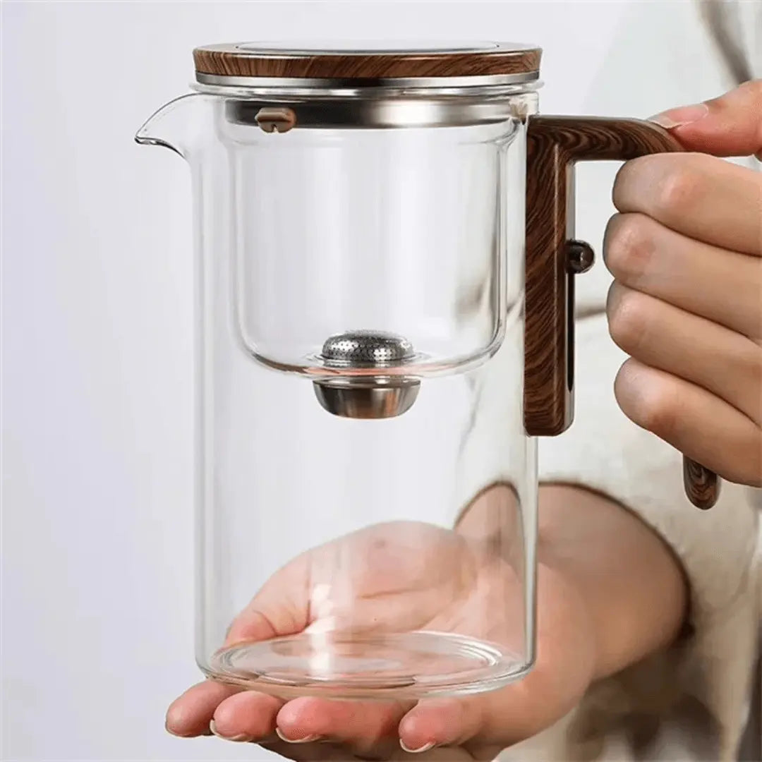 Modern glass teapot & tea kettle, transparent design for elegant hot beverage brewing.