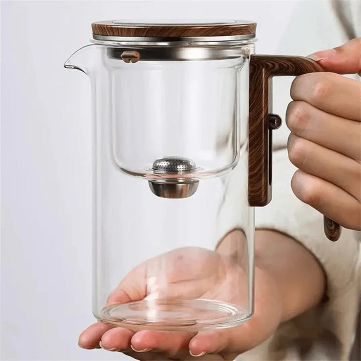 Modern glass teapot & tea kettle, transparent design for elegant hot beverage brewing.