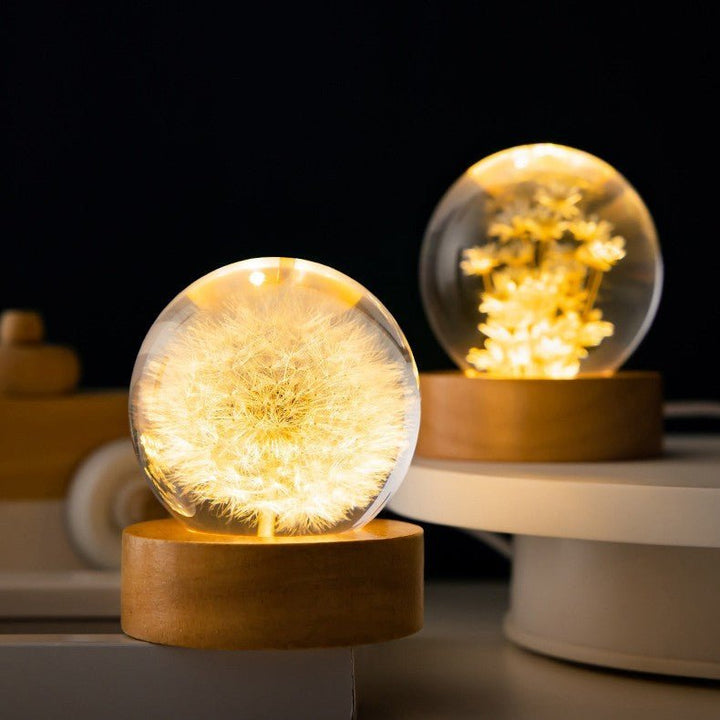 LED crystal ball desk lamp featuring eternal flowers like dandelion for soft ambient light & decor.