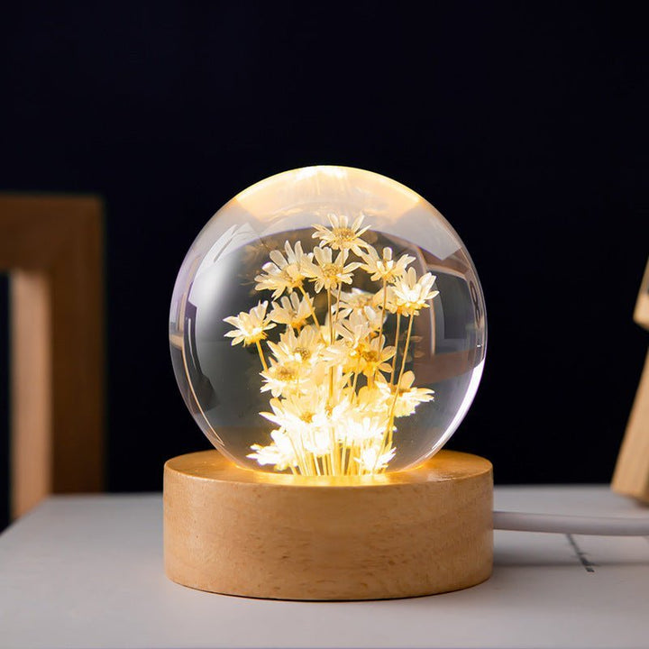 Unique crystal ball lamp with delicate eternal flowers, ideal for ambient home decor or a special gift.