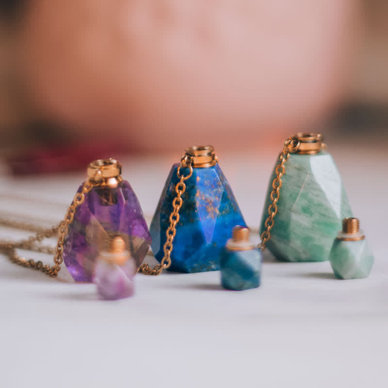 Fashionable crystal necklace with a refillable perfume bottle, great for essential oils.