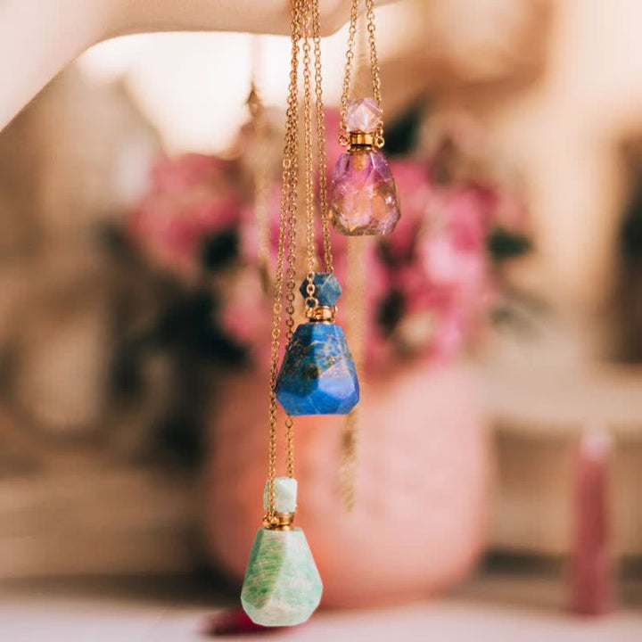 Women's delicate crystal perfume bottle necklace, combining style with aromatherapy.