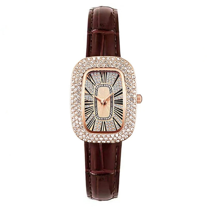 Elegant women's rose gold watch with crystal accents, a rectangular dial & leather strap.