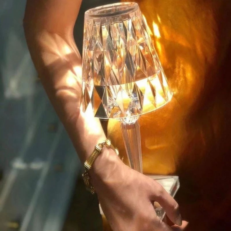 Compact wireless crystal table lamp with touch control, delivering warm LED lighting.
