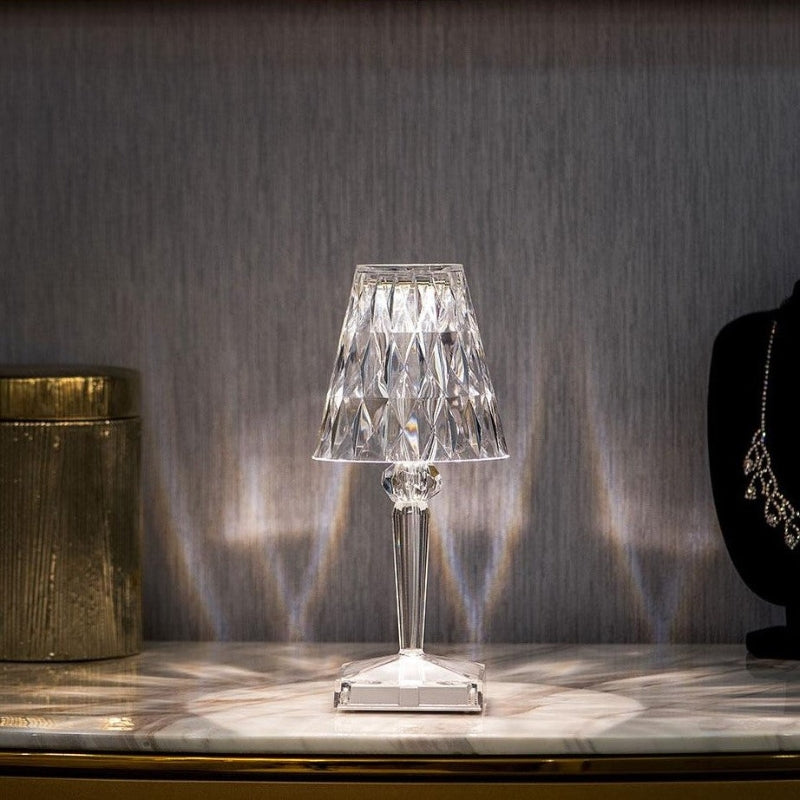 Atmospheric crystal table lamp with touch control, illuminating a room with soft LED light.