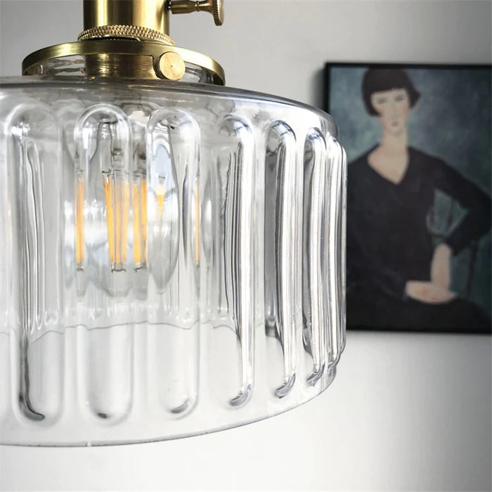 Vintage crystal pendant lamp provides elegant ambient lighting for a serene bedroom interior design.