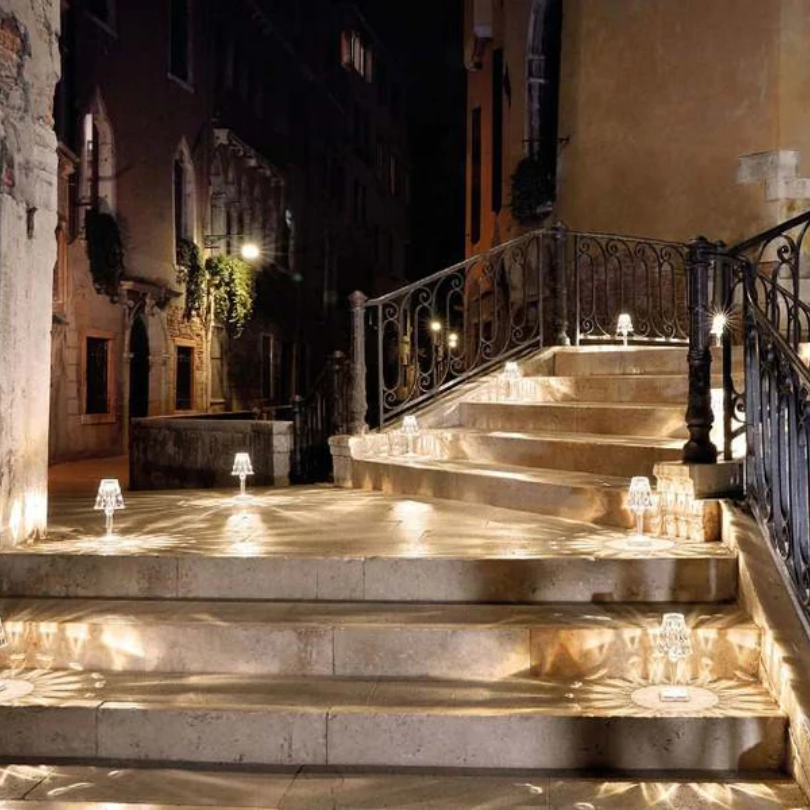 Table lamp with crystal design, provides warm ambient light for any room.