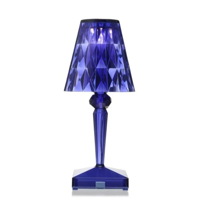 Blue crystal table lamp, modern design for ambient bedroom lighting.