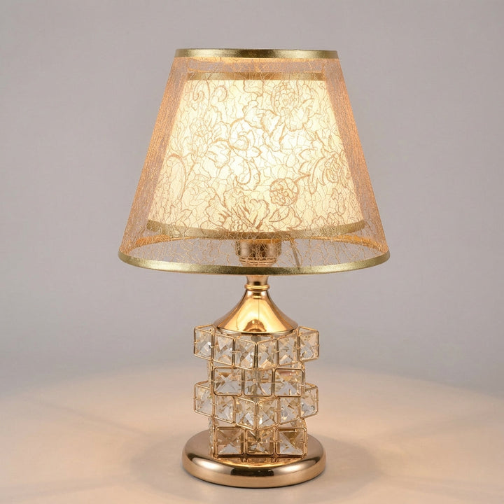 Dimmable crystal table lamp in silver, providing sophisticated accent lighting for any room.