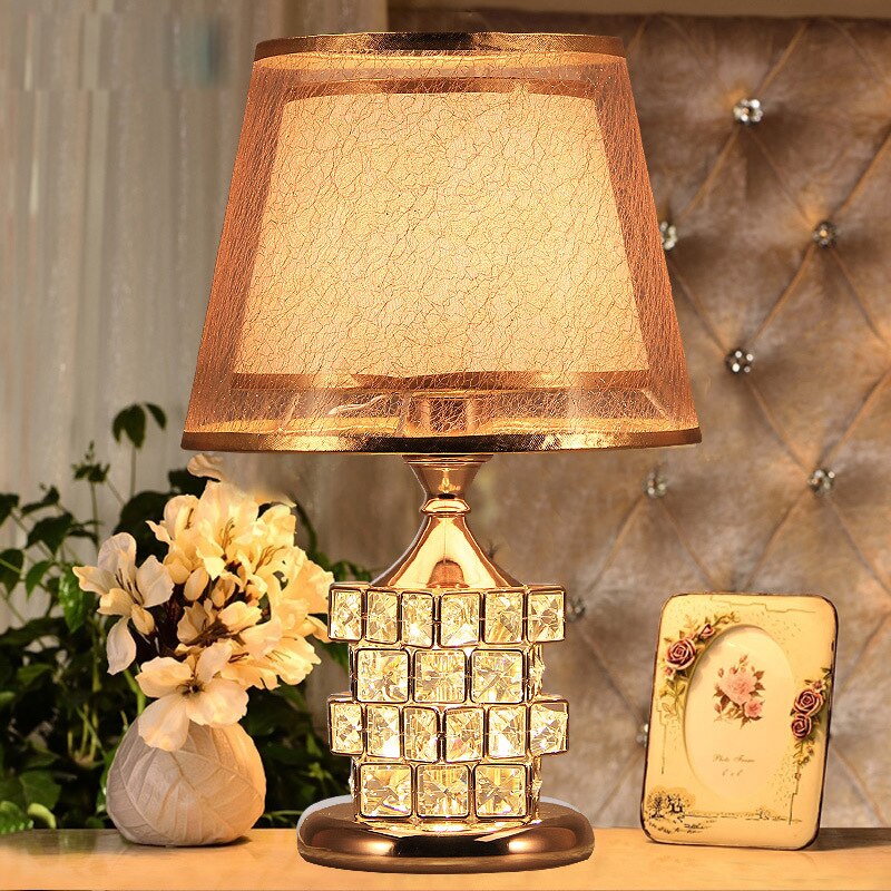 Close-up of a Crystelleon crystal table lamp showcasing its intricate design and brilliant light.
