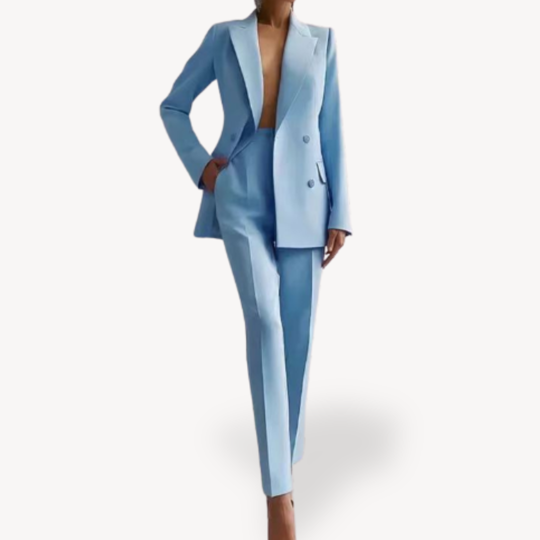 Modern elegant double-breasted blazer paired with tailored pants, forming a complete women's suit.
