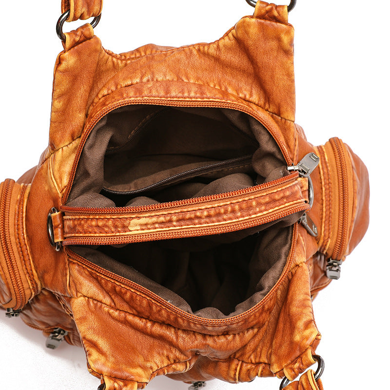 Sleek women's faux leather shoulder bag, offering elegant style and versatile crossbody wear.