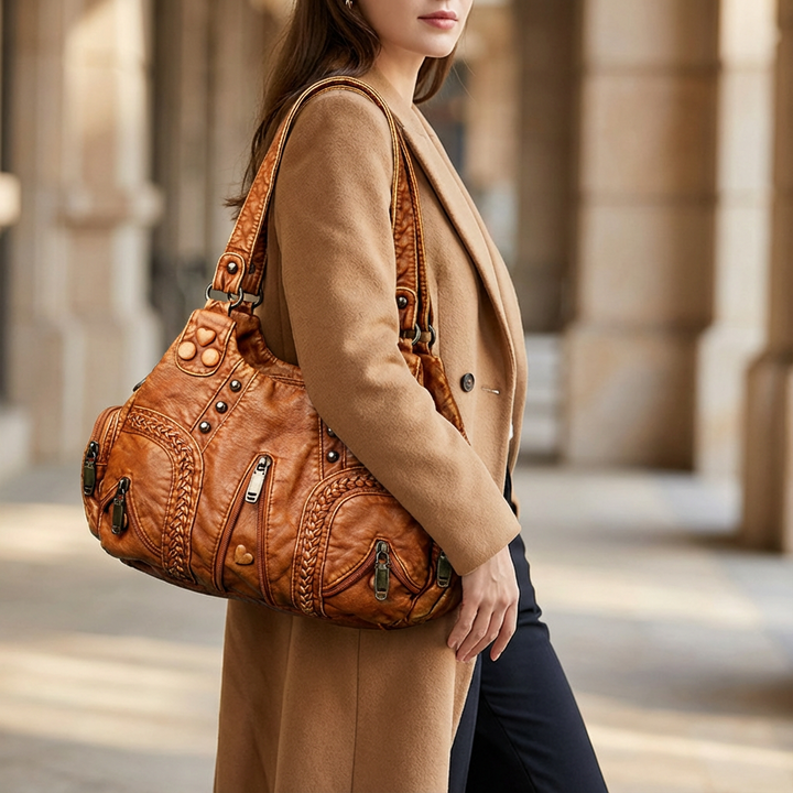 Luxurious women's faux leather shoulder bag, an elegant and organized versatile crossbody handbag.
