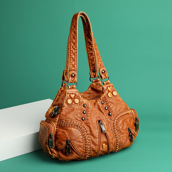 Sophisticated women's faux leather shoulder bag, an elegant accessory and versatile crossbody.