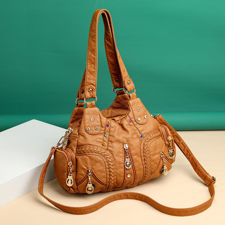 High-quality faux leather shoulder bag for women, elegant design with versatile crossbody functionality.
