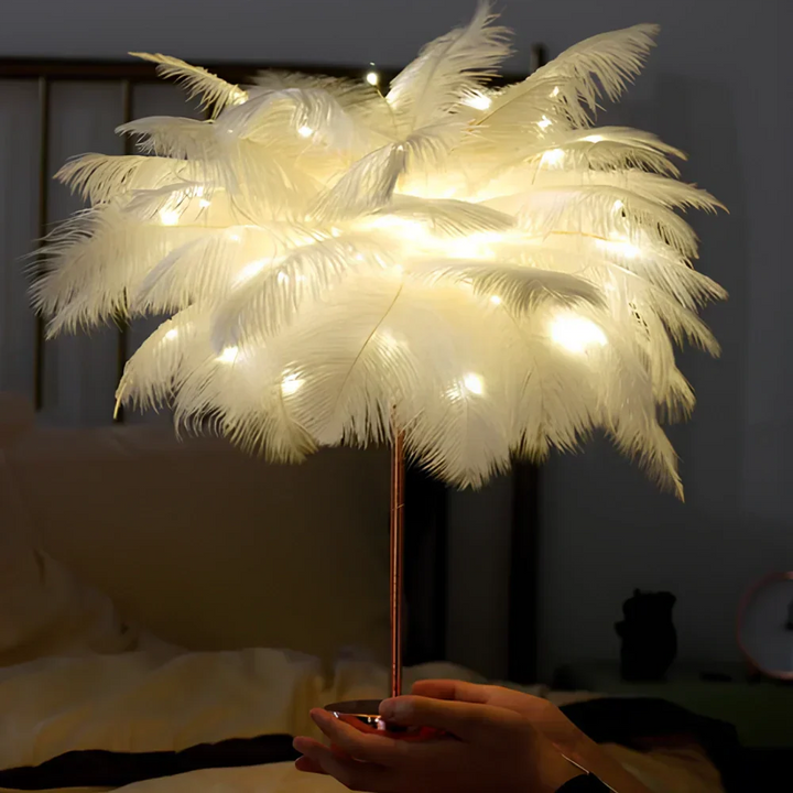 Detailed view of the remote control for the decorative feather palm tree lamp.