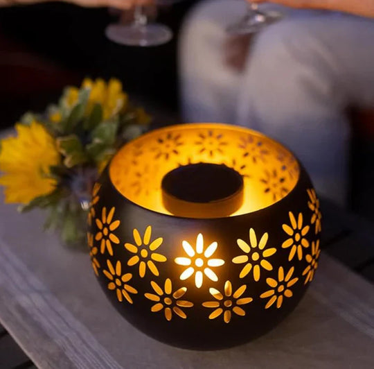 Versatile floral candle warmer and essential oil diffuser. Provides dimmable lighting and soothing scents.