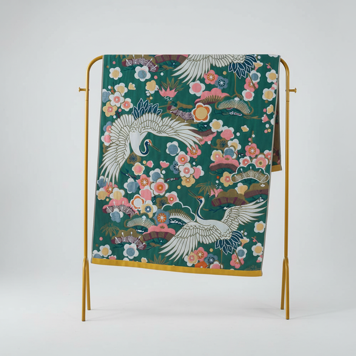 FlowerLuxe elegant bath towel featuring a vibrant floral print, made from plush cotton, ideal for spa or home.