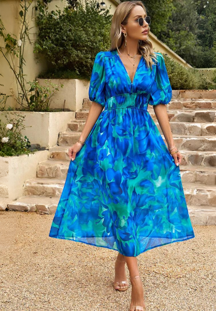 Women's V-neck floral print midi dress, elegant A-line cut & trendy puff sleeves. Occasion wear.