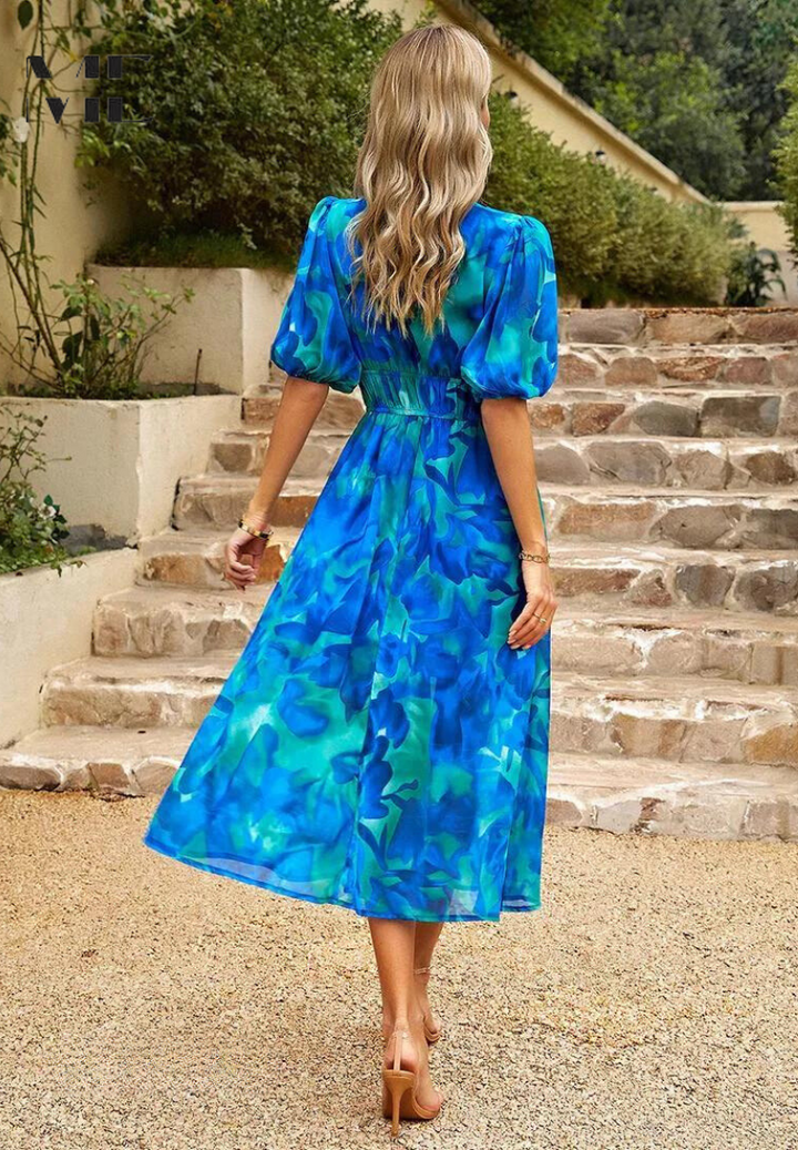 Feminine floral midi dress, elegant puff sleeves, V-neck, A-line silhouette, elastic waist.