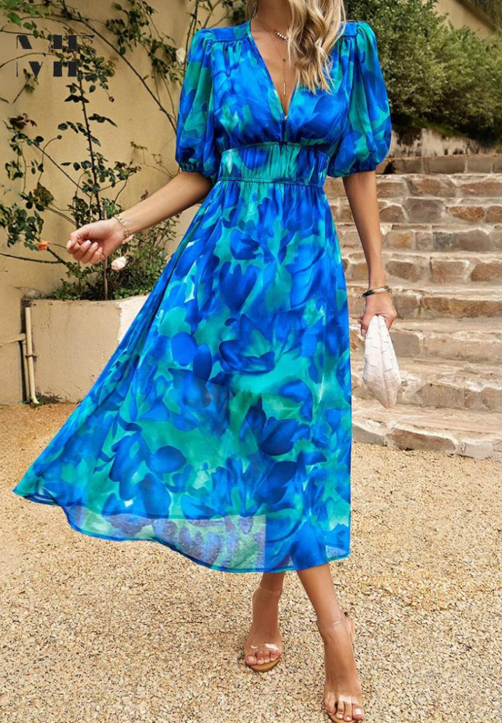 Elegant women's midi dress, delicate floral print, stylish puff sleeves, V-neck design.