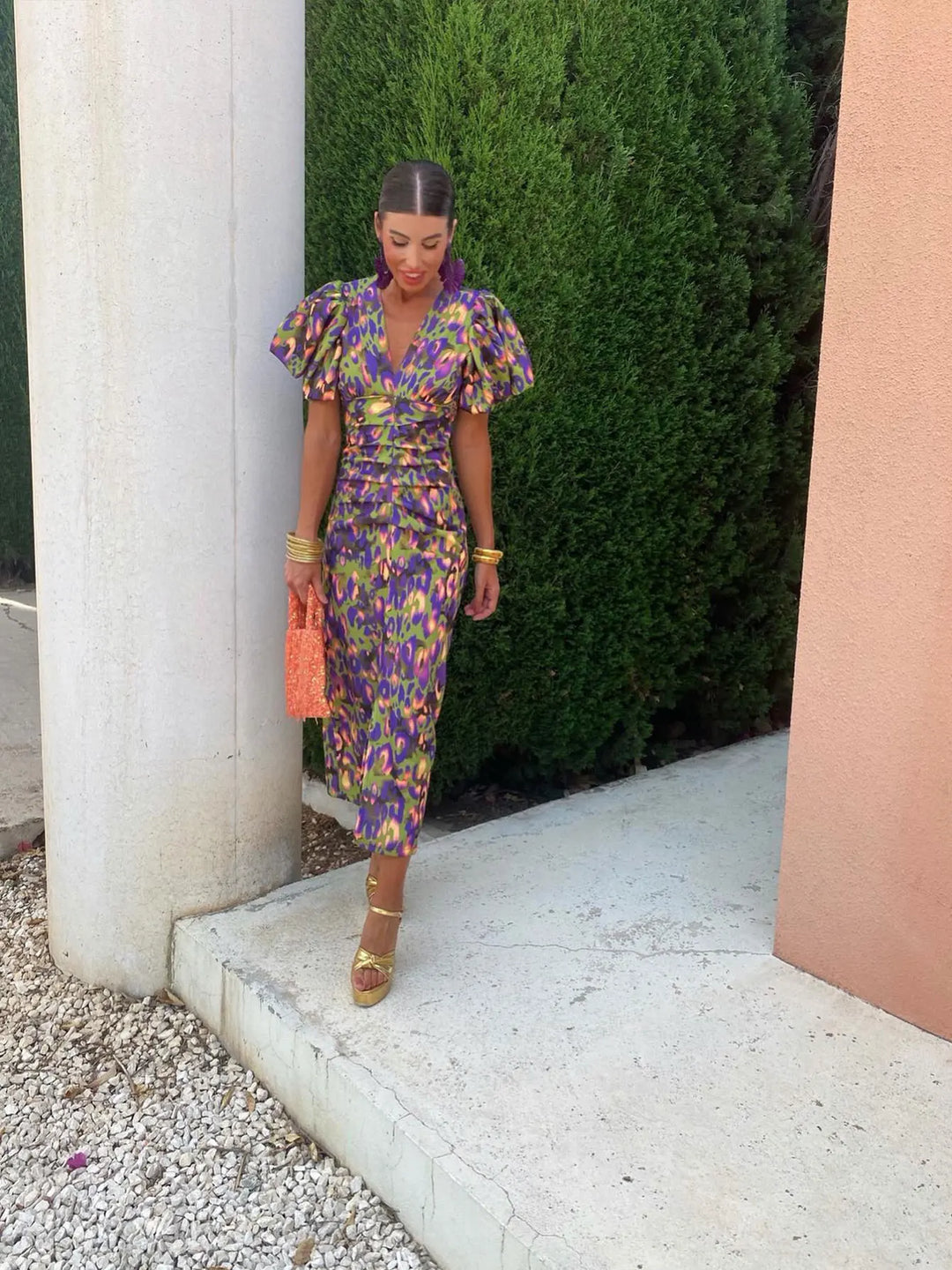 Women's vibrant floral summer midi dress with puff sleeves, a V-neck, and an elegant, casual style.