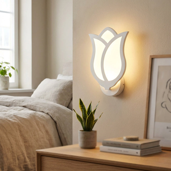 Elegant Florique wall sconce with detailed floral design, casting ambient LED light, perfect for modern home decor.