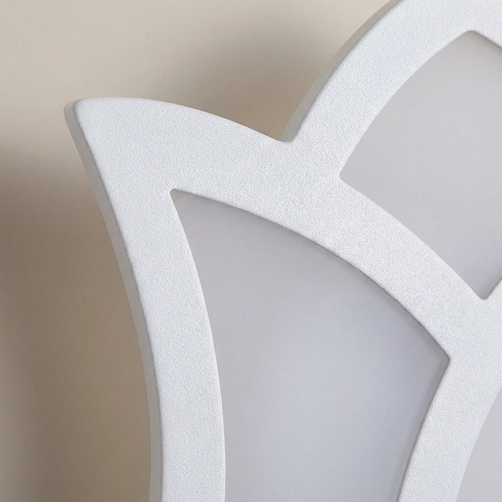 Modern Florique floral sconce mounted on a wall, providing energy-efficient ambient lighting for any room.