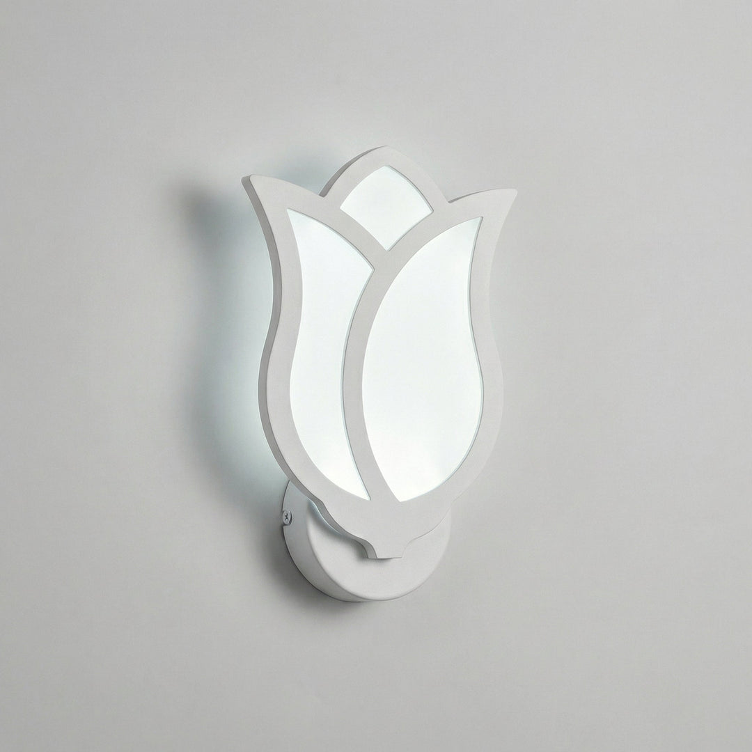 Florique wall mounted floral sconce glowing with warm LED light, creating a cozy and inviting atmosphere indoors.