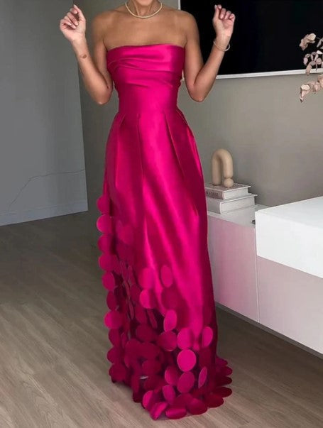 Women's formal strapless maxi dress, ideal for wedding guests or special occasions, featuring an elegant petal hem.