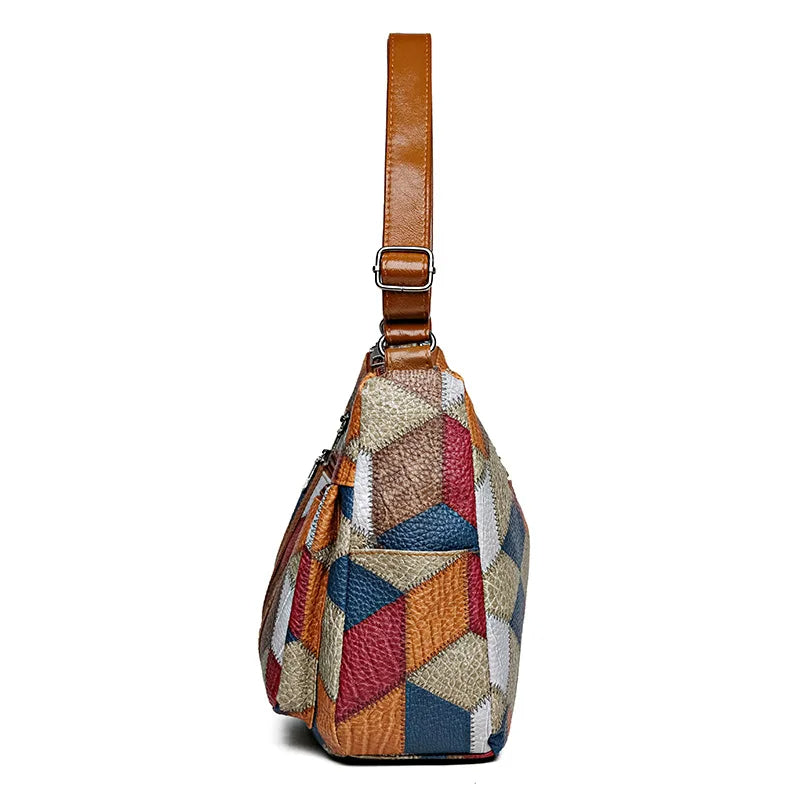 Trendy geometric patchwork women's handbag, a fashionable vegan leather accessory.