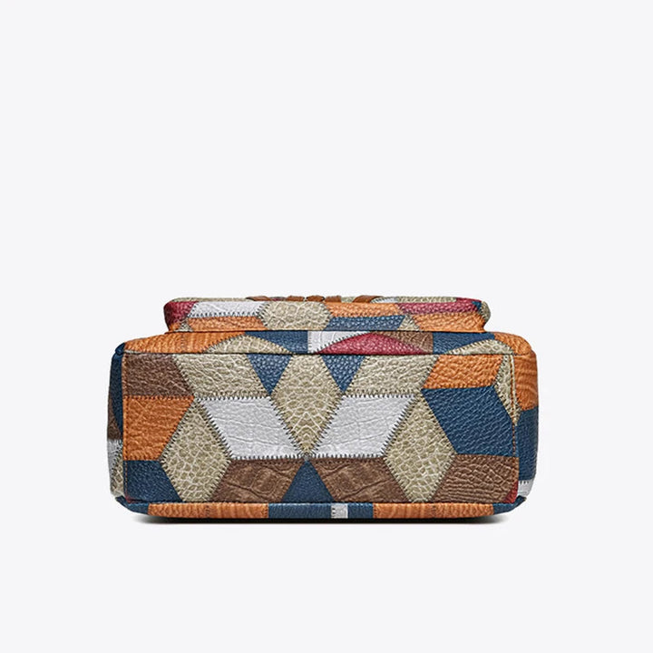 Close-up: Elegant geometric patchwork detail on a women's vegan leather shoulder bag.