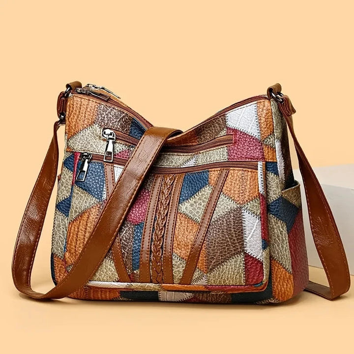 Stylish patchwork vegan leather shoulder bag for women, featuring a unique geometric design.