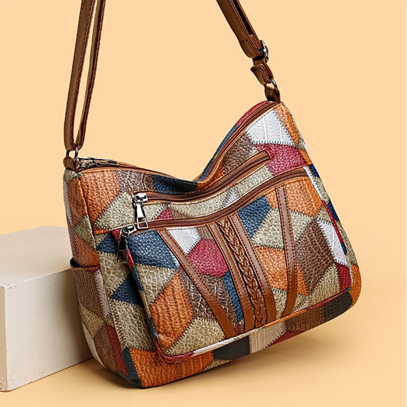 Fashionable geometric patchwork women's handbag, crafted from elegant vegan leather.