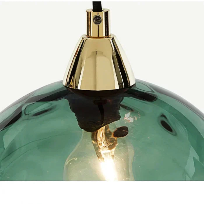 Stylish glass ball hanging lamp with E27 fixture, perfect for modern kitchen island lighting.