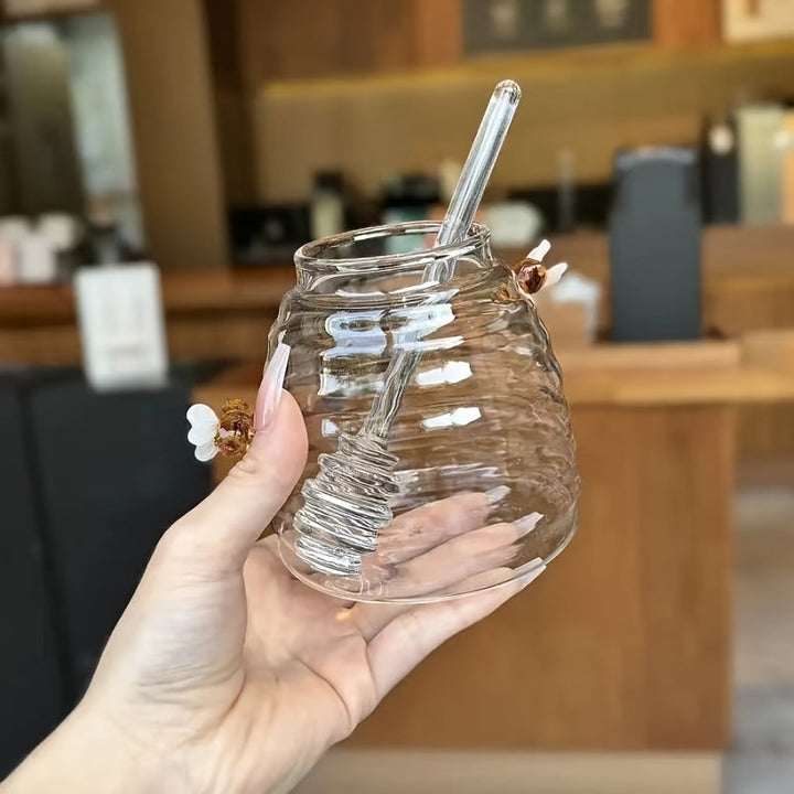Serving ware: Elegant glass honey jar, beehive shape, with a practical dipper for drizzling.
