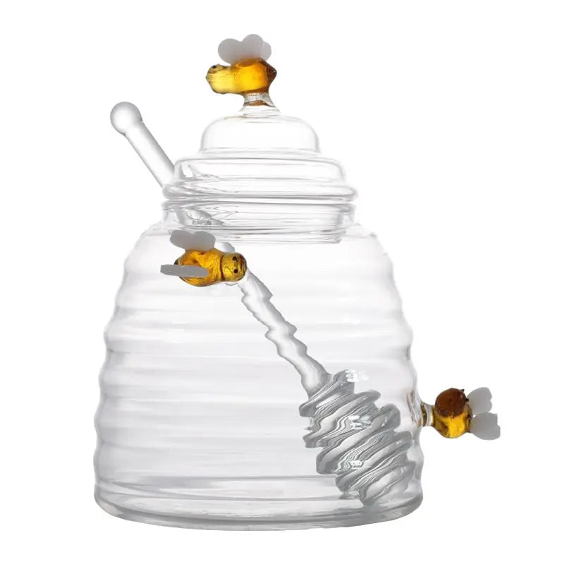 Handy borosilicate glass beehive honey pot with dipper for easy, mess-free honey dispensing.