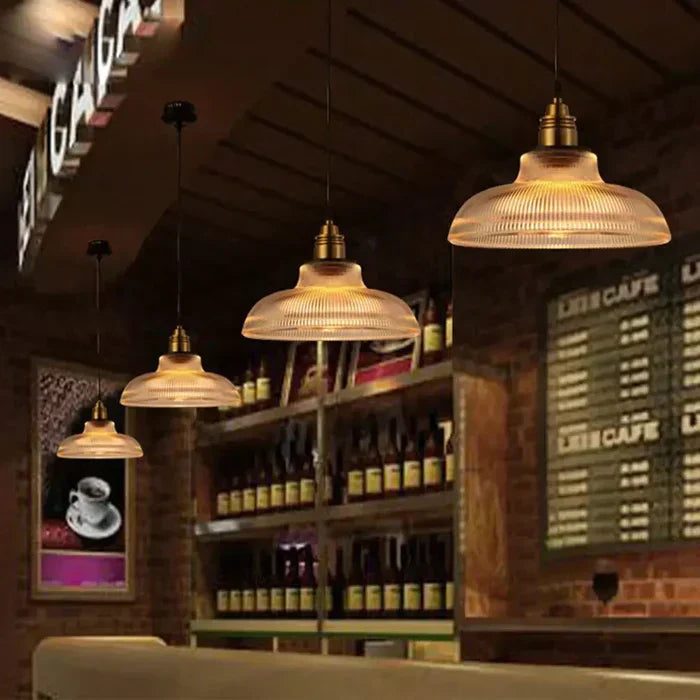 Modern glass pendant light, perfect for living rooms. Designer ceiling light creating warm, inviting ambiance.