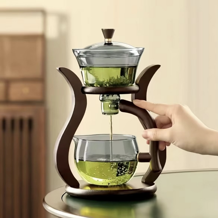 Elegant glass pour over coffee maker with built-in tea infuser, perfect for brewing hot beverages.