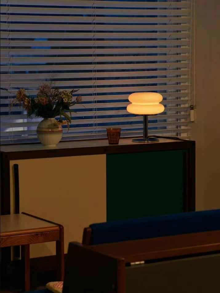 Decorative table lamp featuring clear glass and energy-efficient LED lighting.